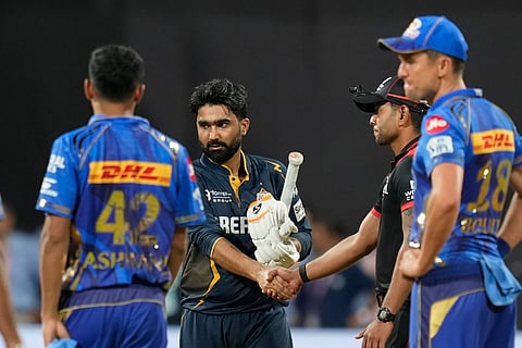 Gujarat Titans' Rahul Tewatia shakes hands with a match official after defeating Mumbai Indians during the Indian Premier League cricket match between Mumbai Indians and Gujarat Titans at Wankhede Stadium in Mumbai, India, Tuesday, May 6, 2025. 

