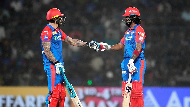Delhi Capitals' Faf du Plessis, left, and batting partner KL Rahul touch gloves during the Indian Premier League cricket match in New Delhi. - AP Photo/Manish Swarup