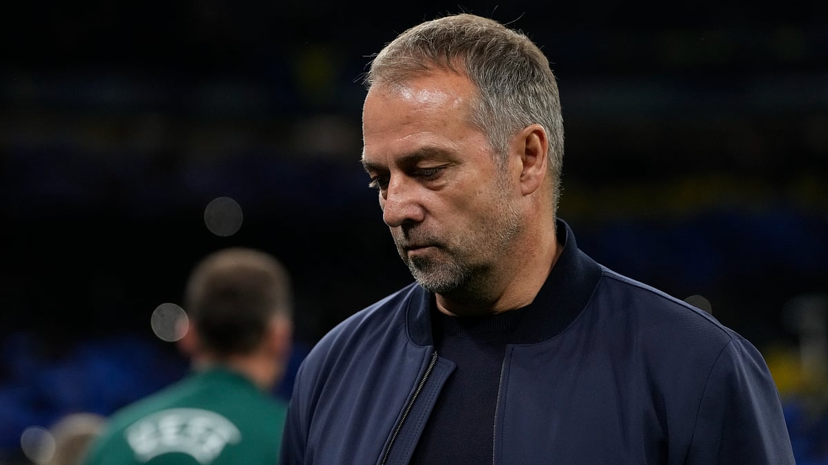 Barcelona coach Hansi Flick looks dejected after their loss to Inter.