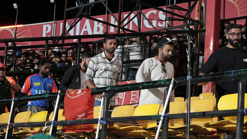 Spectators leave the stands after authorities evacuated the stadium. AP Photo