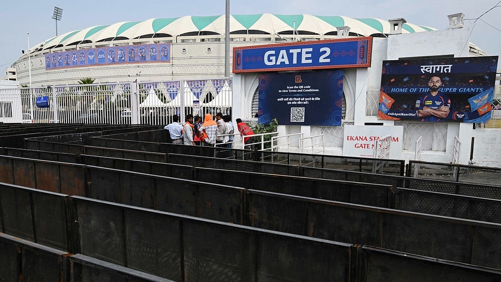 AP : Fans wait outside a closed entrance of Ekana Cricket Stadium in Lucknow after organizers suspended the Indian Premier League for one week.
