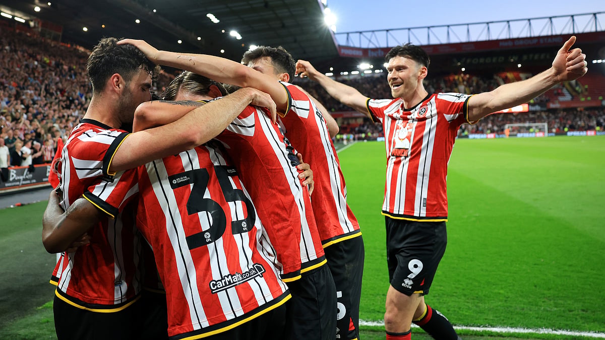 Kieffer Moore and Sheffield United team-mates celebrate their second goal on Monday