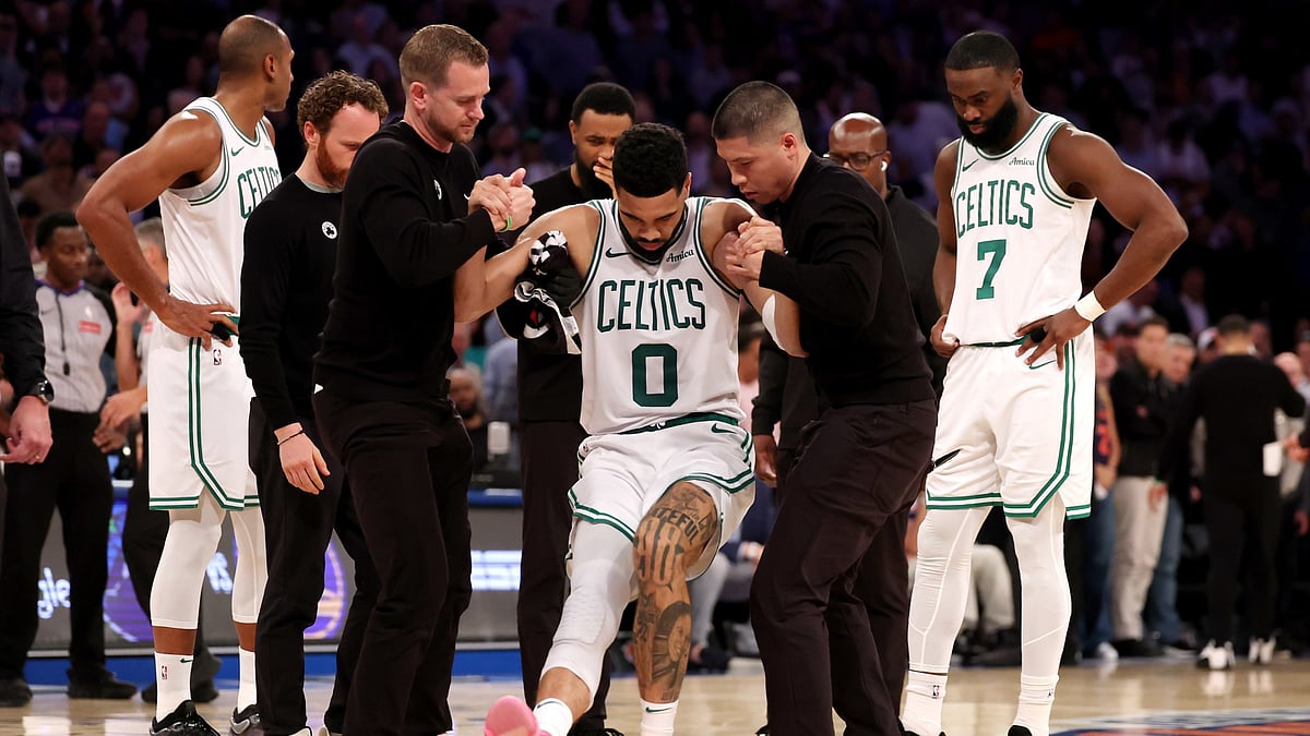 Jayson Tatum is helped off the court during Game 4 of the Boston Celtics' 2025 playoff series vs. the New York Knicks