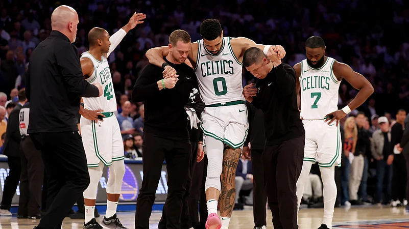 Jayson Tatum is helped to the locker room