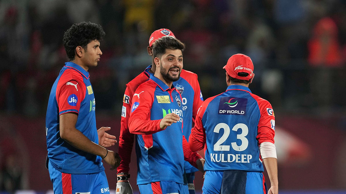 Players of Delhi Capitals celebrate the dismissal. AP