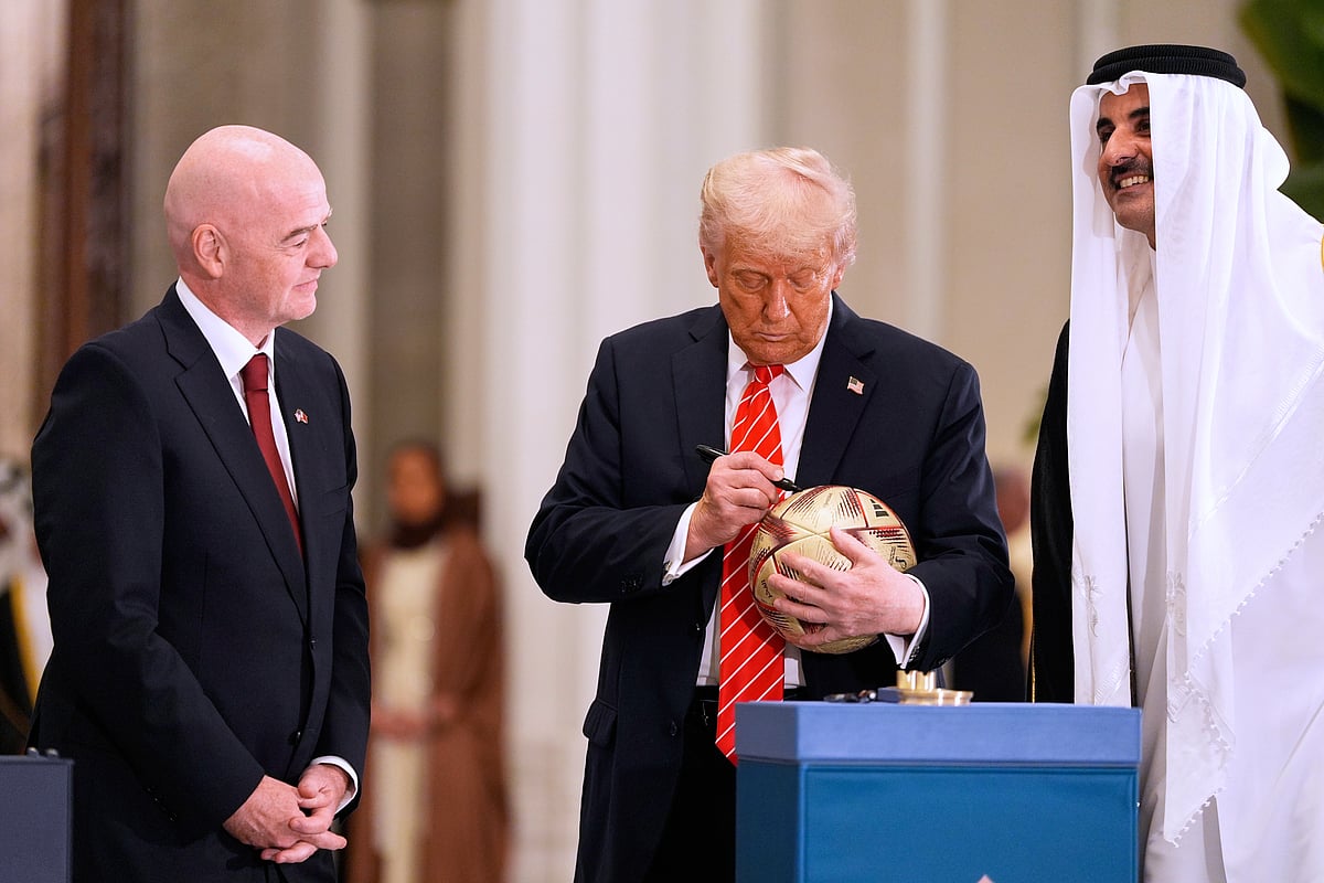Donald Trump Sheikh Tamim bin Hamad Al Thani Gianni Infantino Doha 2025 AP Photo