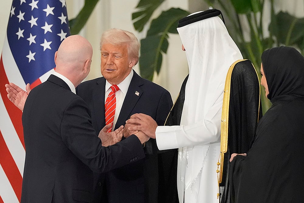 Donald Trump with Qatars Emir Sheikh Tamim bin Hamad Al Thani and Gianni Infantino 