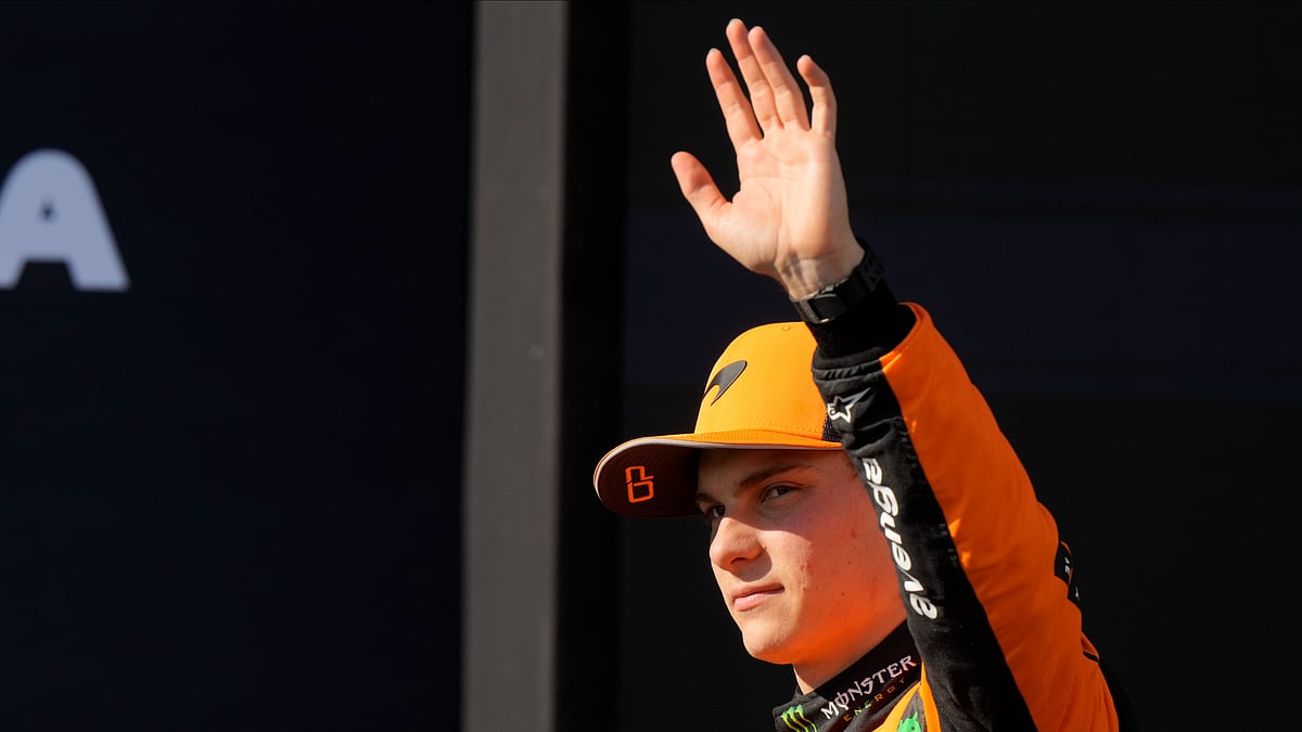 AP Photo/Luca Bruno : McLaren driver Oscar Piastri of Australia celebrates his pole position after the qualifying session ahead of the Italy's Emilia Romagna Formula One Grand Prix, at the Enzo and Dino Ferrari racetrack in Imola, Italy.