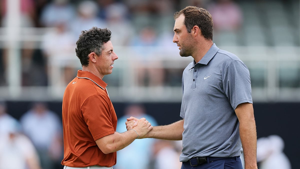 Rory McIlroy and Scottie Scheffler shake hands after their second rounds at Quail Hollow - null