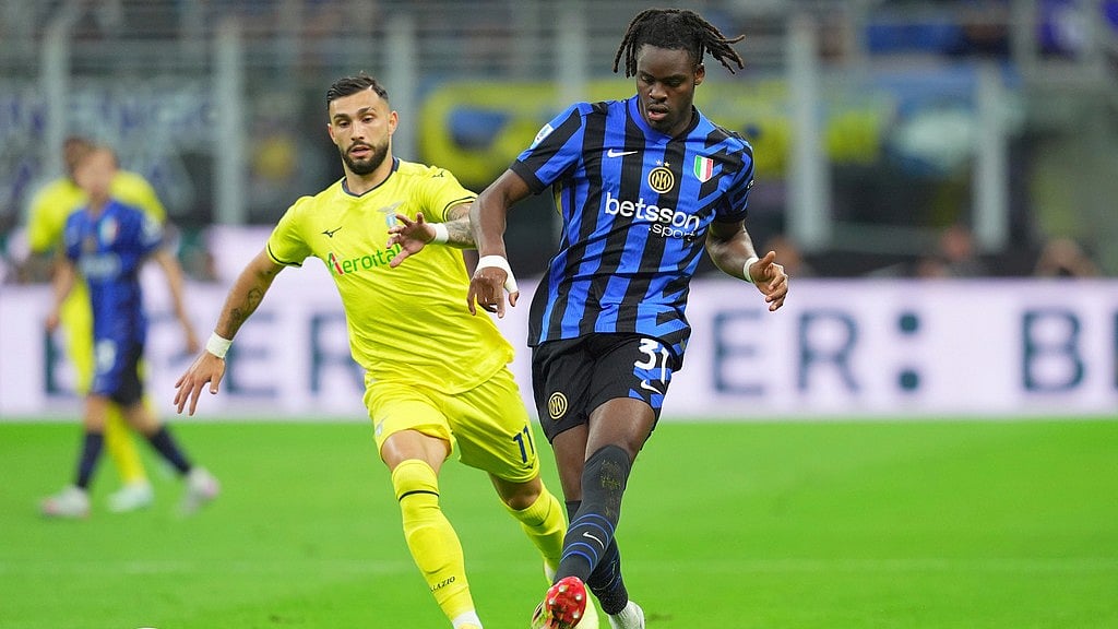 Photo: Spada//LaPresse via AP : Inter Milan's Yann Bisseck fights for the ball with Lazio's Taty Castellanos during their Italian Serie A match at San Siro Stadium in Milan.