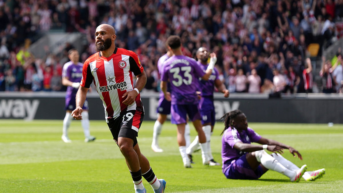 Bradley Collyer/PA via AP : Brentford's Bryan Mbeumo celebrates scoring his side's first goal of the game, during the English Premier League match at the Gtech Community Stadium, in Brentford, England.