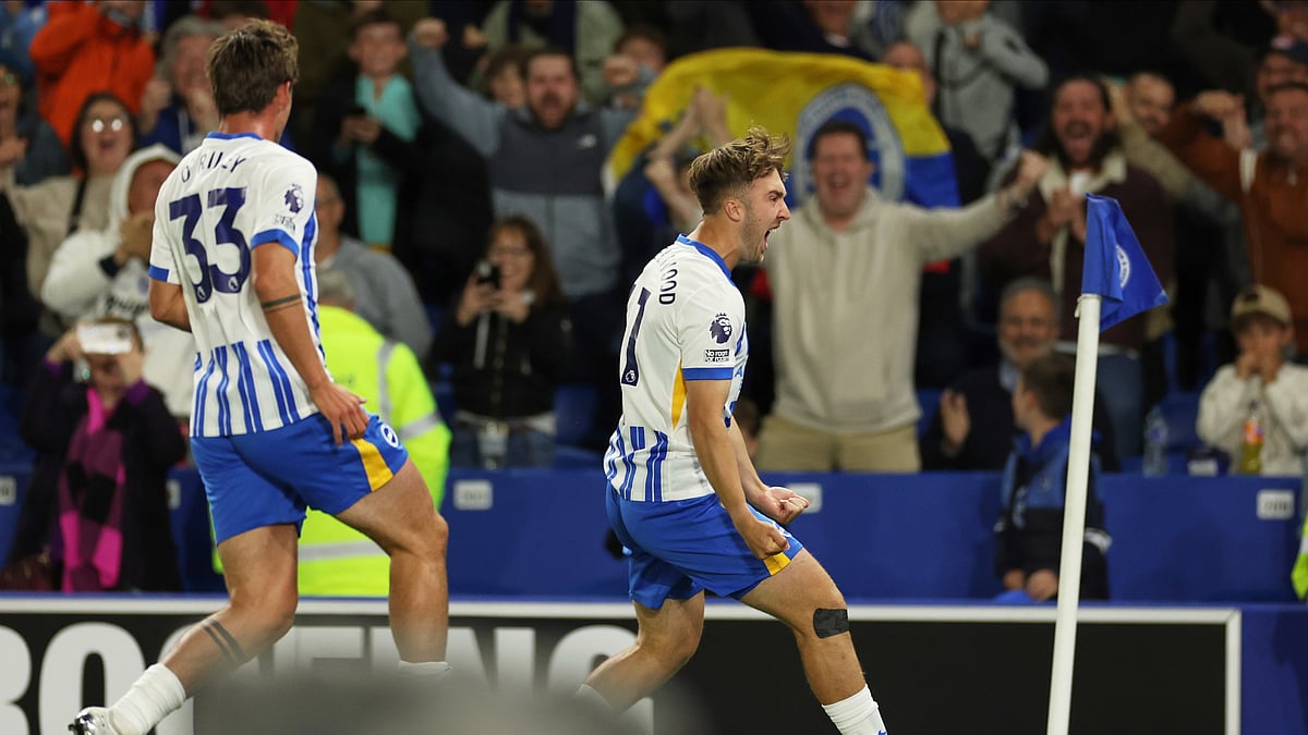 (AP Photo/Ian Walton) : Brighton's Jack Hinshelwood celebrates after scoring his side's third goal during the English Premier League soccer match between Brighton and Liverpool at American Express Stadium in Brighton, England, Monday, May 19, 2025. 