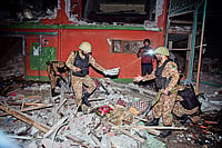 | Photo: AP : Strike Back: Soldiers inspect a building damaged by an Indian missile attack near Muzaffarabad in Pakistan-occupied Kashmir on 
May 7, 2025