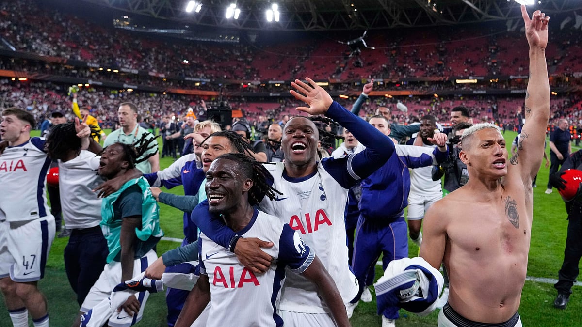 Photo: AP : Tottenham players celebrate their victory after the Europa League final against Manchester United at the San Mames Stadium in Bilbao, Spain.