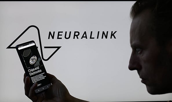 Brussels, Belgium, on May 10, 2024. (Photo by Jonathan Raa/NurPhoto via Getty Images) : The Neuralink website is being displayed on a smartphone with the Neuralink logo visible in the background in this photo illustration