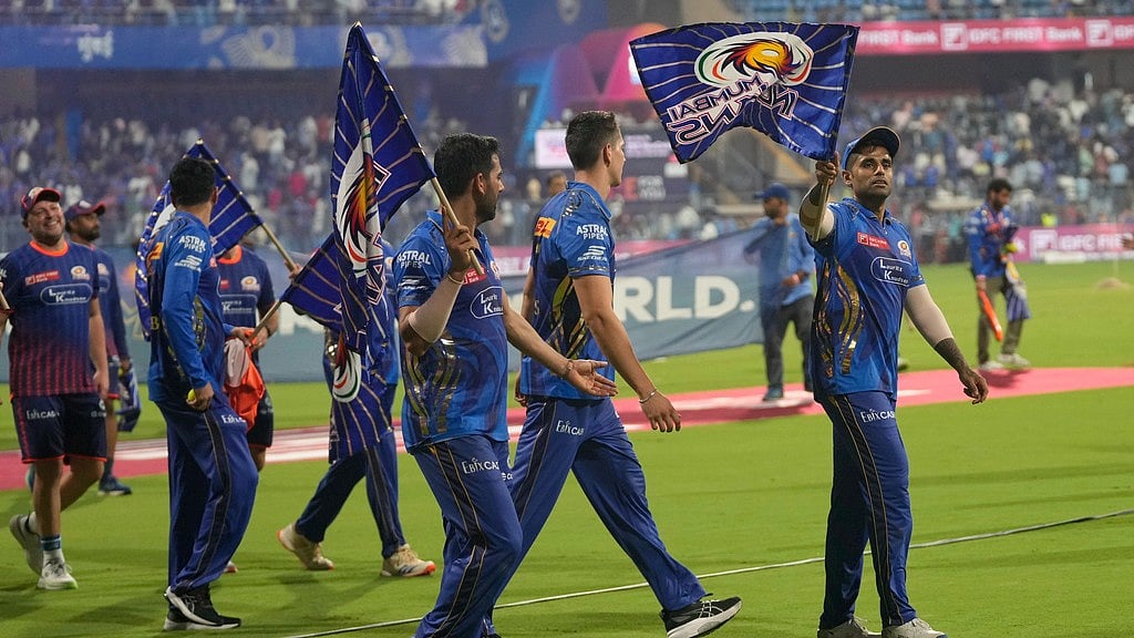 Mumbai Indians' players acknowledge the crowd after winning their Indian Premier League 2025 match against Delhi Capitals at the Wankhede Stadium. - AP