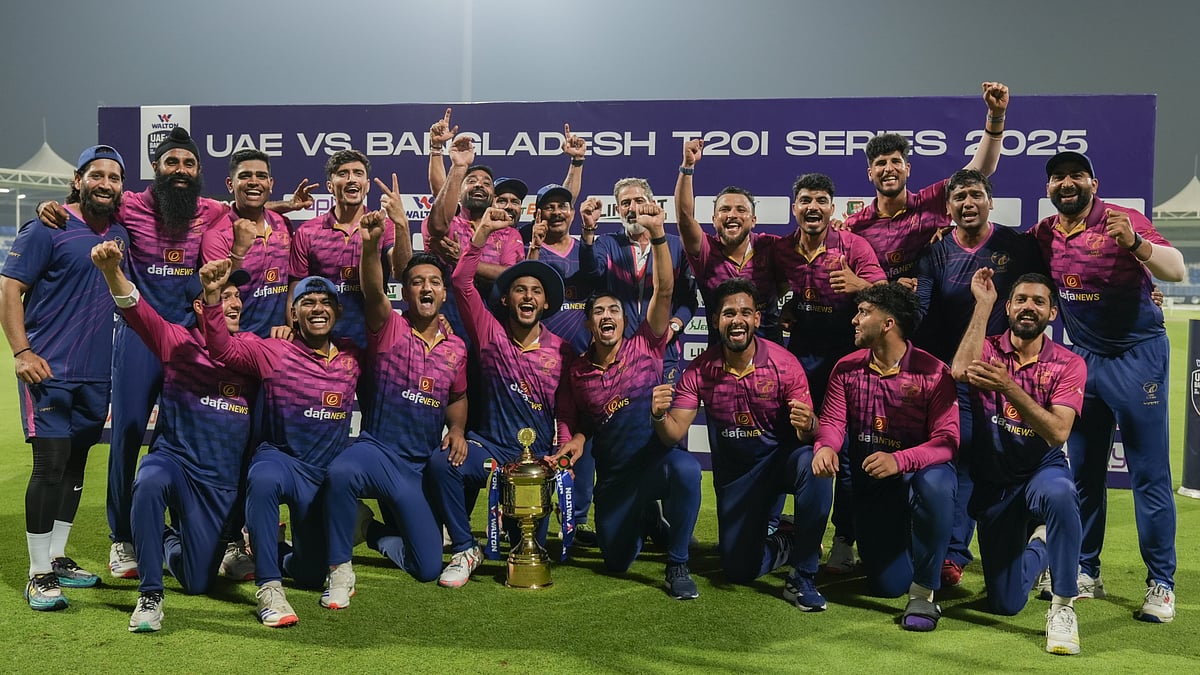 X/EmiratesCricket : The victorious UAE team posing with the trophy.