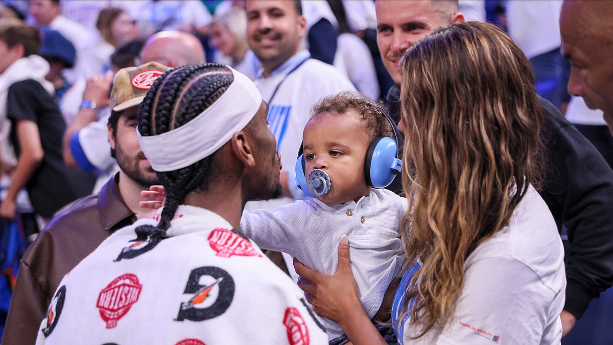 Oklahoma City Thunder guard Shai Gilgeous-Alexander, left, meets with his wife, Hailey Summers, and their son Ares Alexander following Game 1 of an NBA basketball Western Conference Finals playoff series against the Minnesota Timberwolves Tuesday, May 20, 2025, in Oklahoma City.  - (AP Photo/Nate Billings)