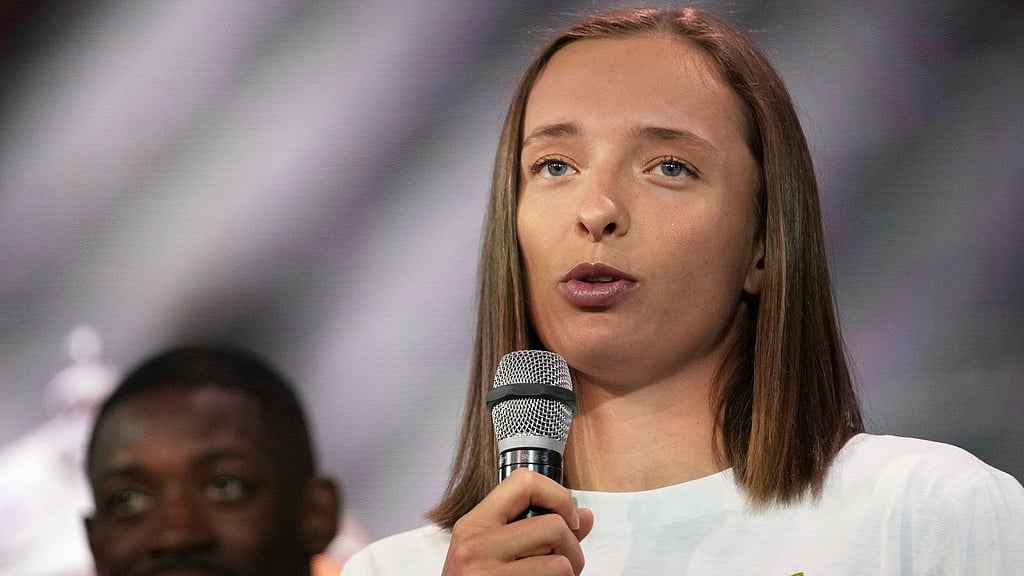 AP : French Open defending champion Iga Swiatek speaks during the draw ceremony at the Roland Garros stadium in Paris.