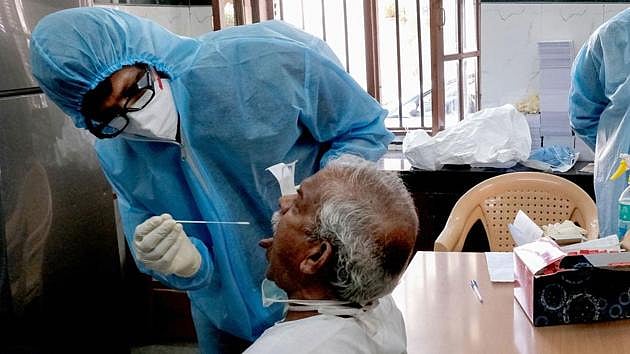 PTI : Covid-19 testing underway at a hospital