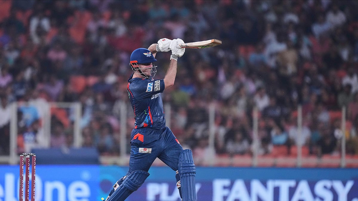 AP Photo/Ajit Solanki : Lucknow Super Giants' Mitchell Marsh plays a shot during the Indian Premier League cricket match between Gujarat Titans and Lucknow Super Giants at Narendra Modi Stadium in Ahmedabad.