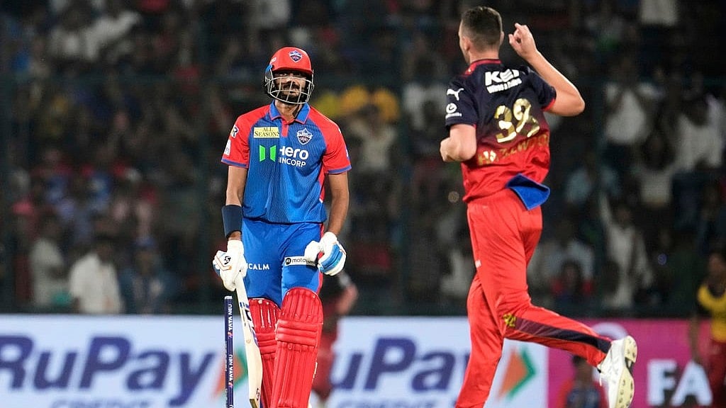 Axar Patel reacts after getting bowled out by Royal Challengers Bengalurus Josh Hazlewood