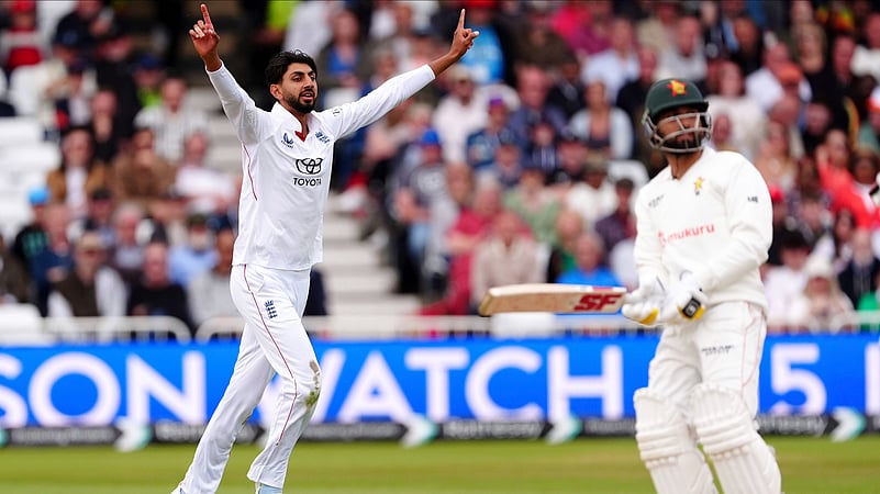 Englands Shoaib Bashir, left, celebrates taking the wicket. AP