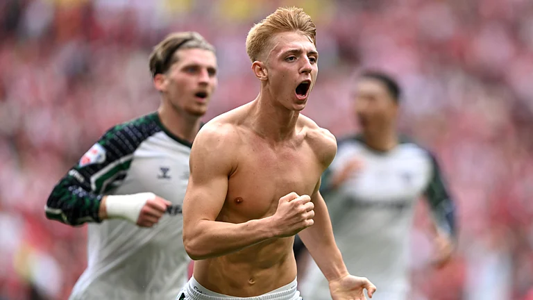 Tom Watson celebrates his goal in the Championship play-off final - null