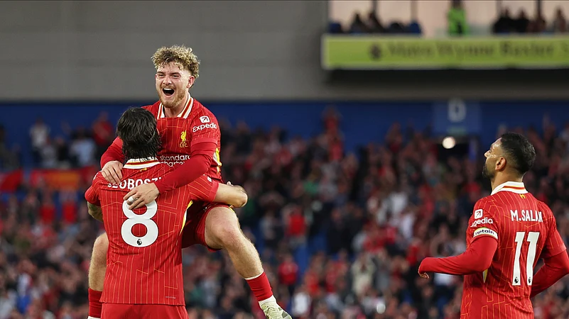 Liverpools Dominik Szoboszlai celebrates with Harvey Elliott. AP