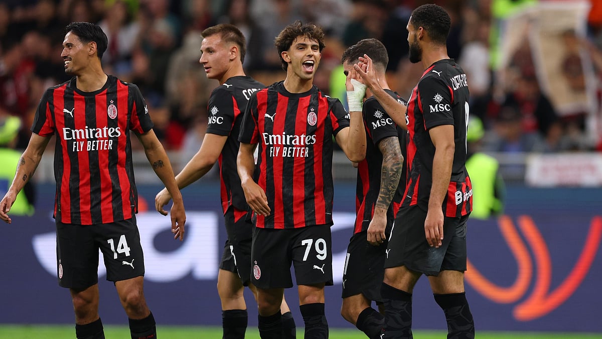 Milan players celebrate with Joao Felix.