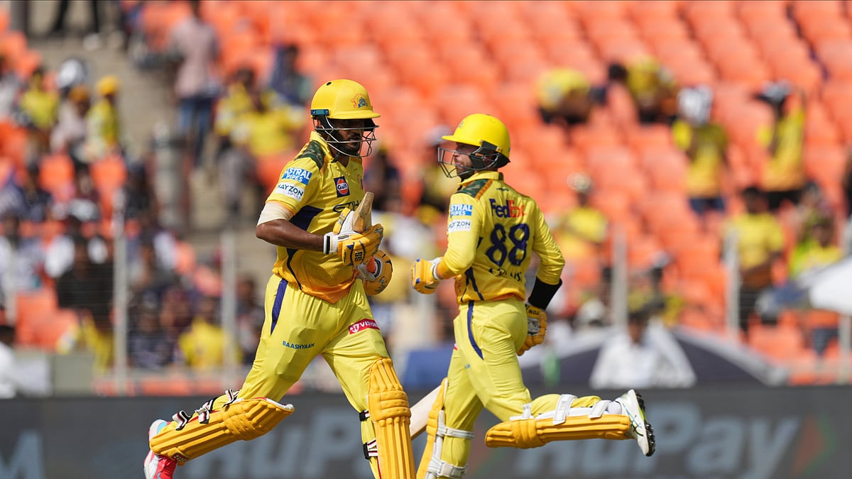 AP Photo/Ajit Solanki : Chennai Super Kings' Urvil Patel, left, and Devon Conway run between the wickets to score during the Indian Premier League cricket match in Ahmedabad.