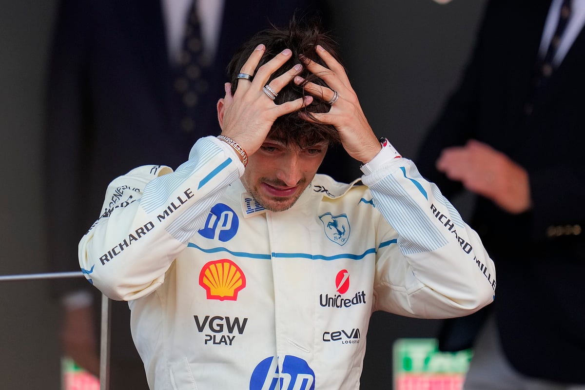 Ferrari driver Charles Leclerc of Monaco reacts on the podium after placing second at the Formula One Monaco Grand Prix race at the Monaco racetrack in Monaco, Sunday, May 25, 2025. 