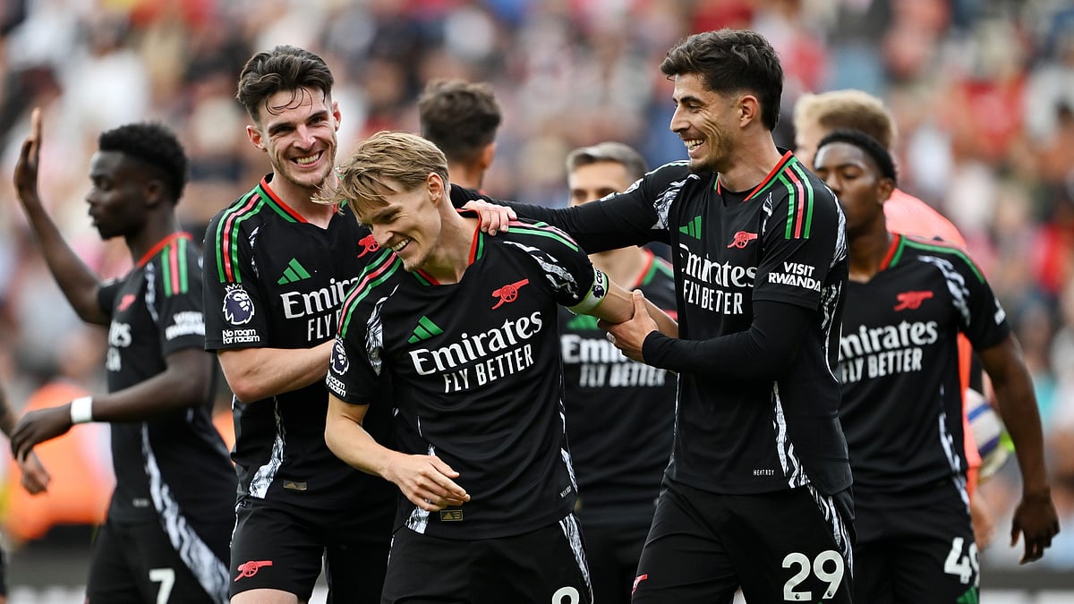 Martin Odegaard celebrates with his teammates. - null