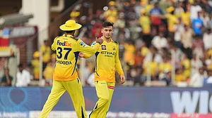 AP Photo/Ajit Solanki : Chennai Super Kings' Noor Ahmad, right, celebrates the wicket of Gujarat Titans' Rashid Khan with Deepak Hooda during the Indian Premier League cricket match in Ahmedabad.