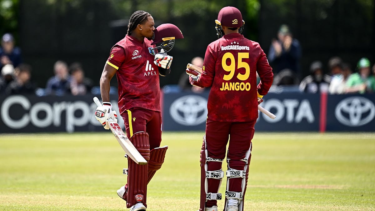 Carty (left) celebrates his century