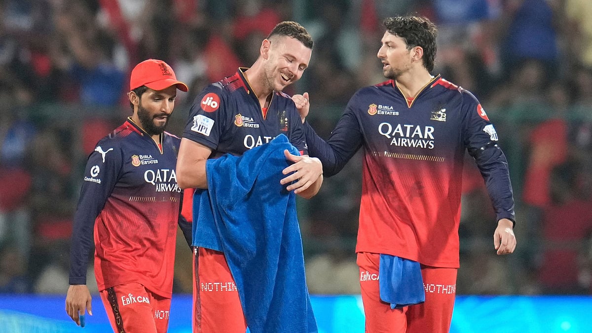 Royal Challengers Bengaluru's Josh Hazlewood celebrates the dismissal of Rajasthan Royals' Dhruv Jurel in IPL 2025.

 - |Photo: AP Photo/Aijaz Rahi