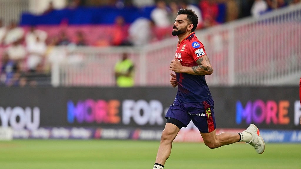 Virat Kohli warming up.