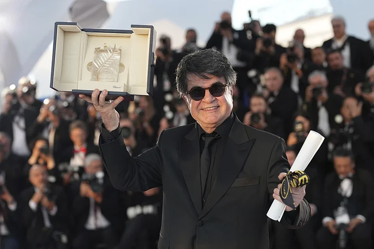 Director Jafar Panahi, winner of the Palme d'Or for the film 'It Was Just an Accident', poses for photographers at the awards ceremony photo call at the 78th international film festival, Cannes, southern France, Saturday, May 24, 2025. - | AP/Natacha Pisarenko