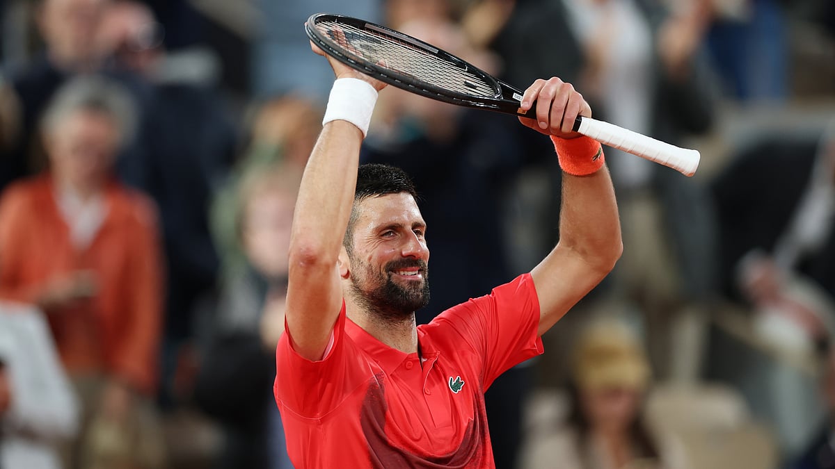 Novak Djokovic celebrates his win over Mackenzie McDonald