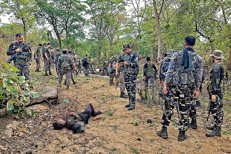 Striking Hard: Security personnel at the site where a Maoist commander was killed in Palamu, Jharkhand on May 27 - Photo: PTI