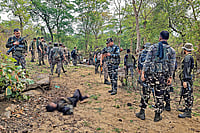 Maoist Conflict At Crossroads: Chhattisgarh’s Opportunity For Peace Photo: PTI : Striking Hard: Security personnel at the site where a Maoist commander was killed in Palamu, Jharkhand on May 27