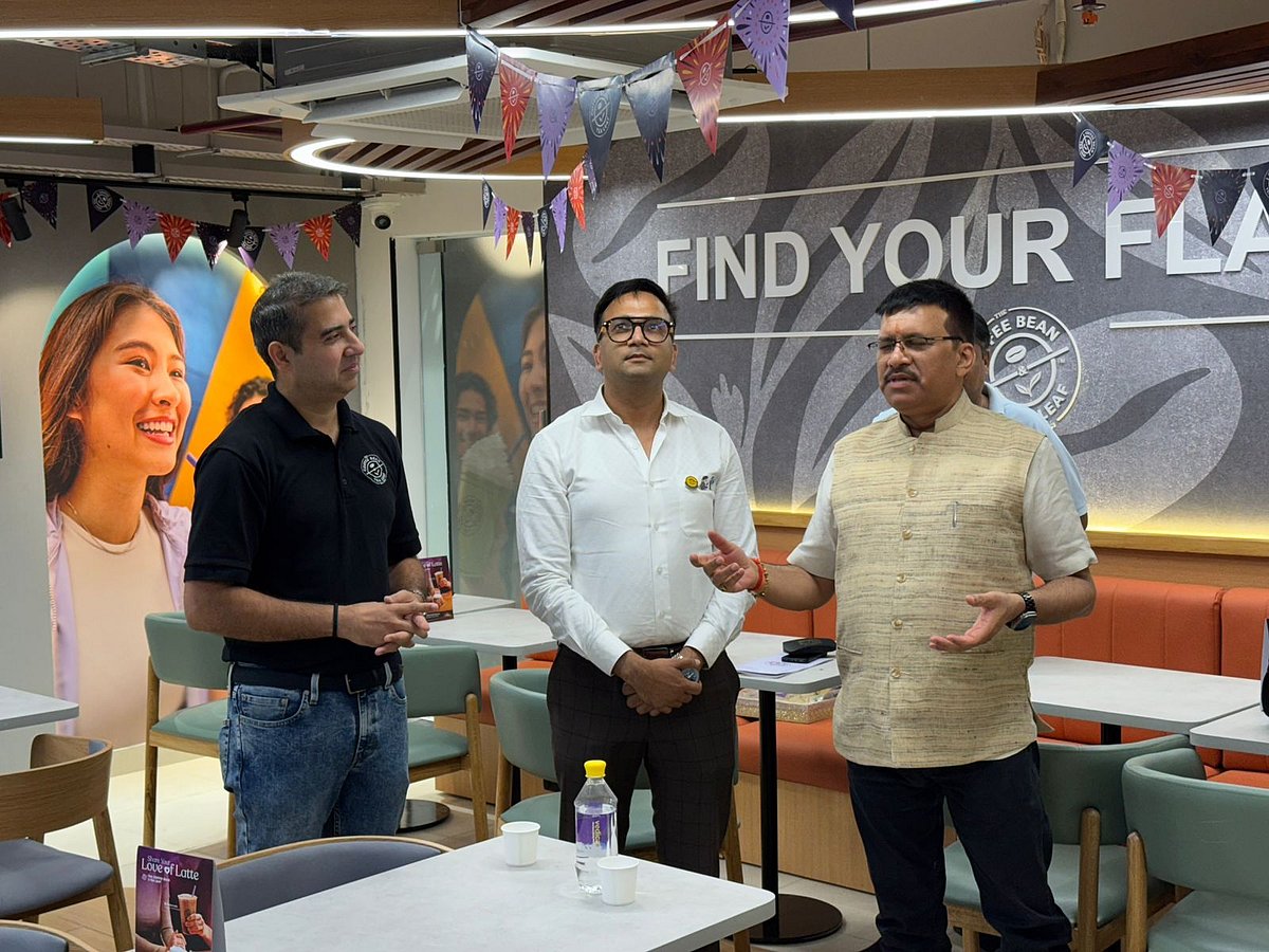 Satendra Singh discussing with two persons