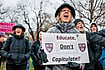 Higher Education Showdown: Trump vs Ivies Photo: Getty Images : ‘Educate, Don’t Capitulate!’: A Cambridge protester urging Harvard to resist Trump’s influence on the institution