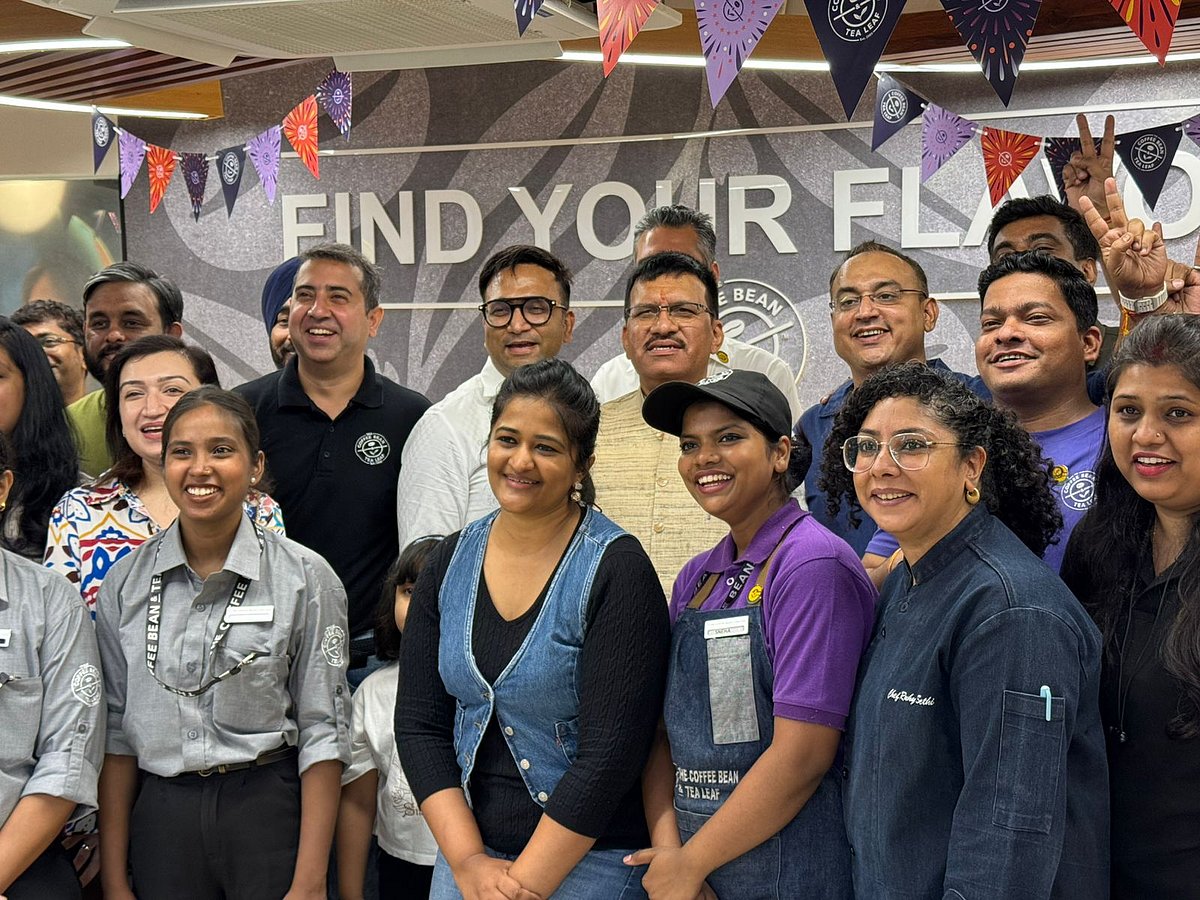 Mr. Satendra Singh with guests and the café team