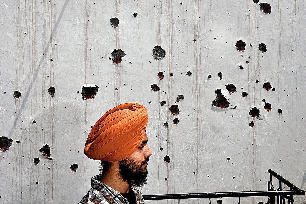 | Photo: Yasir Iqbal : Shattered Lives: A family member of the deceased ex-serviceman, Amarjeet Singh, at their damaged house in Poonch