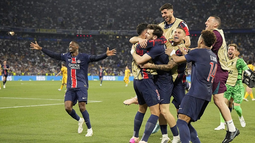 Photo: AP : Paris Saint-Germain's Khvicha Kvaratskhelia, centre, celebrates with his teammates after scoring his side's fourth goal during the Champions League final against Inter Milan at the Allianz Arena in Munich, Germany.