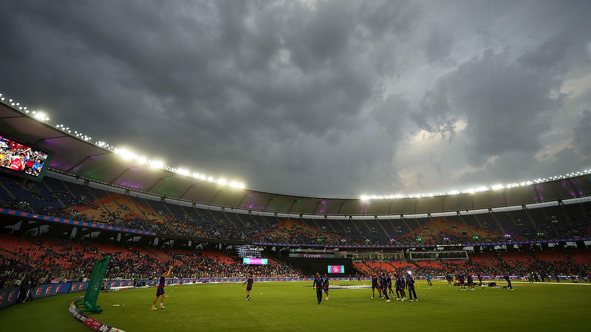 Dark clouds were seen above the Narendra Modi Stadium before the start of the Indian Premier League cricket match between Punjab Kings and Mumbai Indians in Ahmedabad. - AP Photo/Ajit Solanki