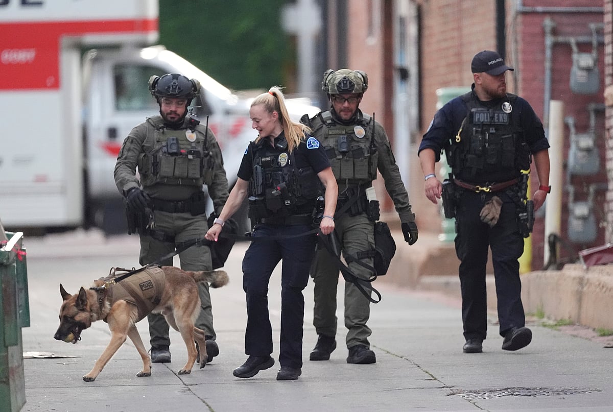 AP Photo/David Zalubowski : Law enforcement officials investigate after an attack on the Pearl Street Mall Sunday, June 1, 2025, in Boulder, Colo. 