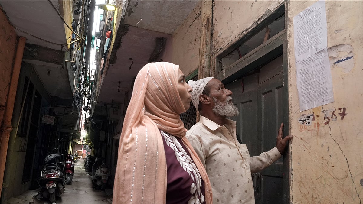 | Tribhuvan Tiwari | : Mohd. Usman looks at the eviction notice stuck outside this house in Khasra No 279, Batla House, Okhla.