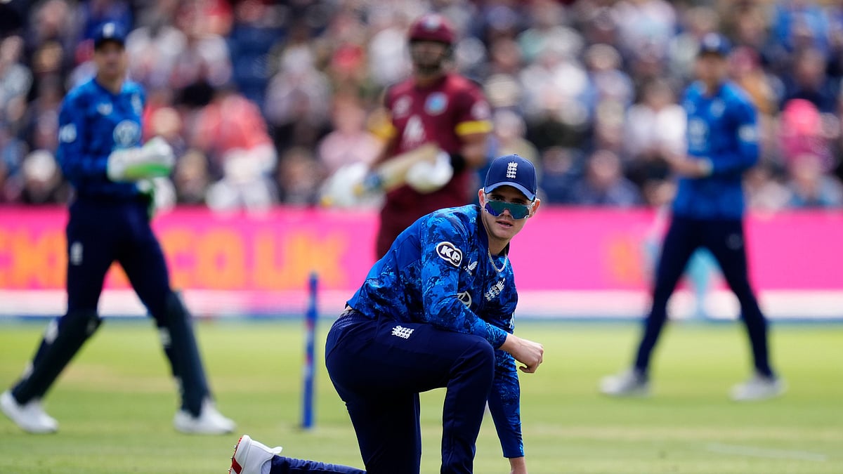 Nick Potts/PA via AP : England's Jacob Bethell watches as a ball passes him while fielding during the second One Day International cricket match between West Indies and England at Sophia Gardens, Cardiff, Wales.